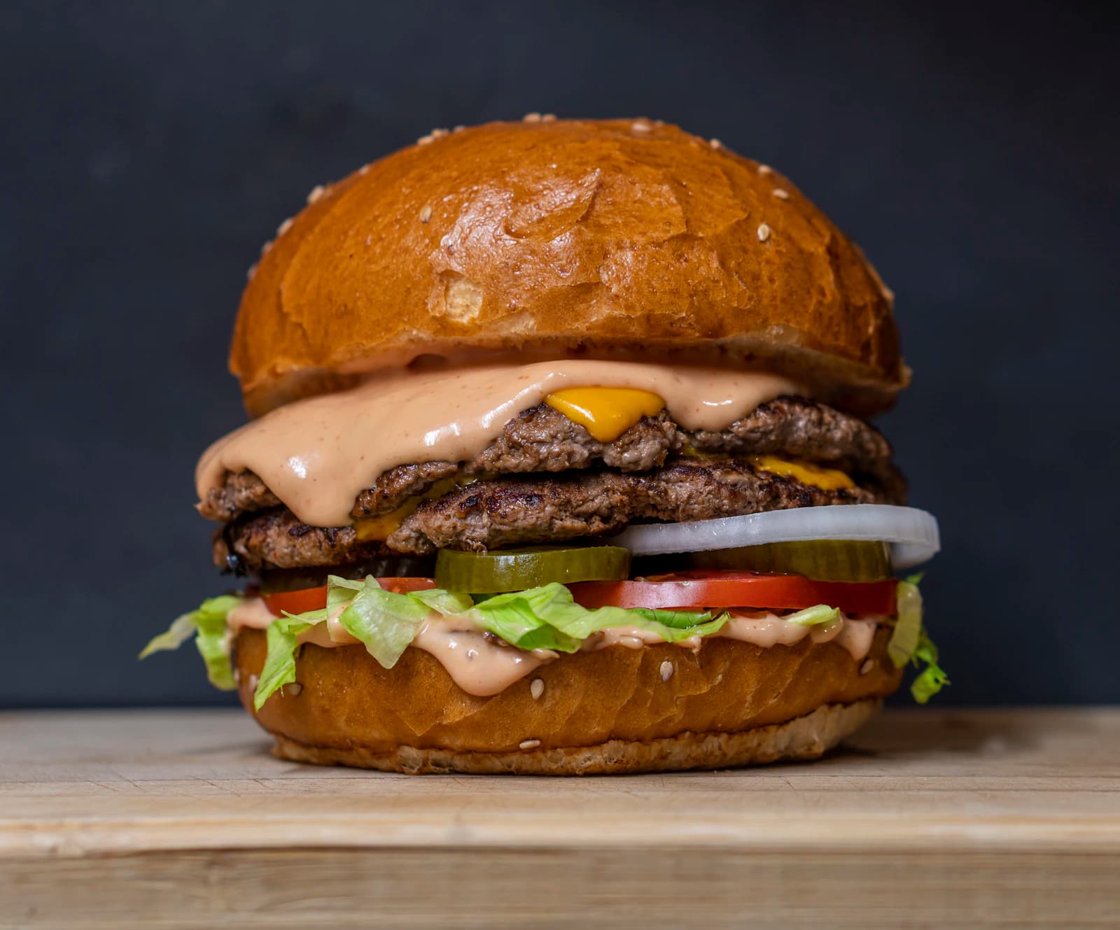 Juicy burger with melted cheddar at Wow Kitchen